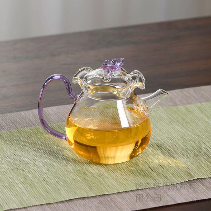 Nieuwe vlinderbloemtheepot van hoog borosilicaatglas